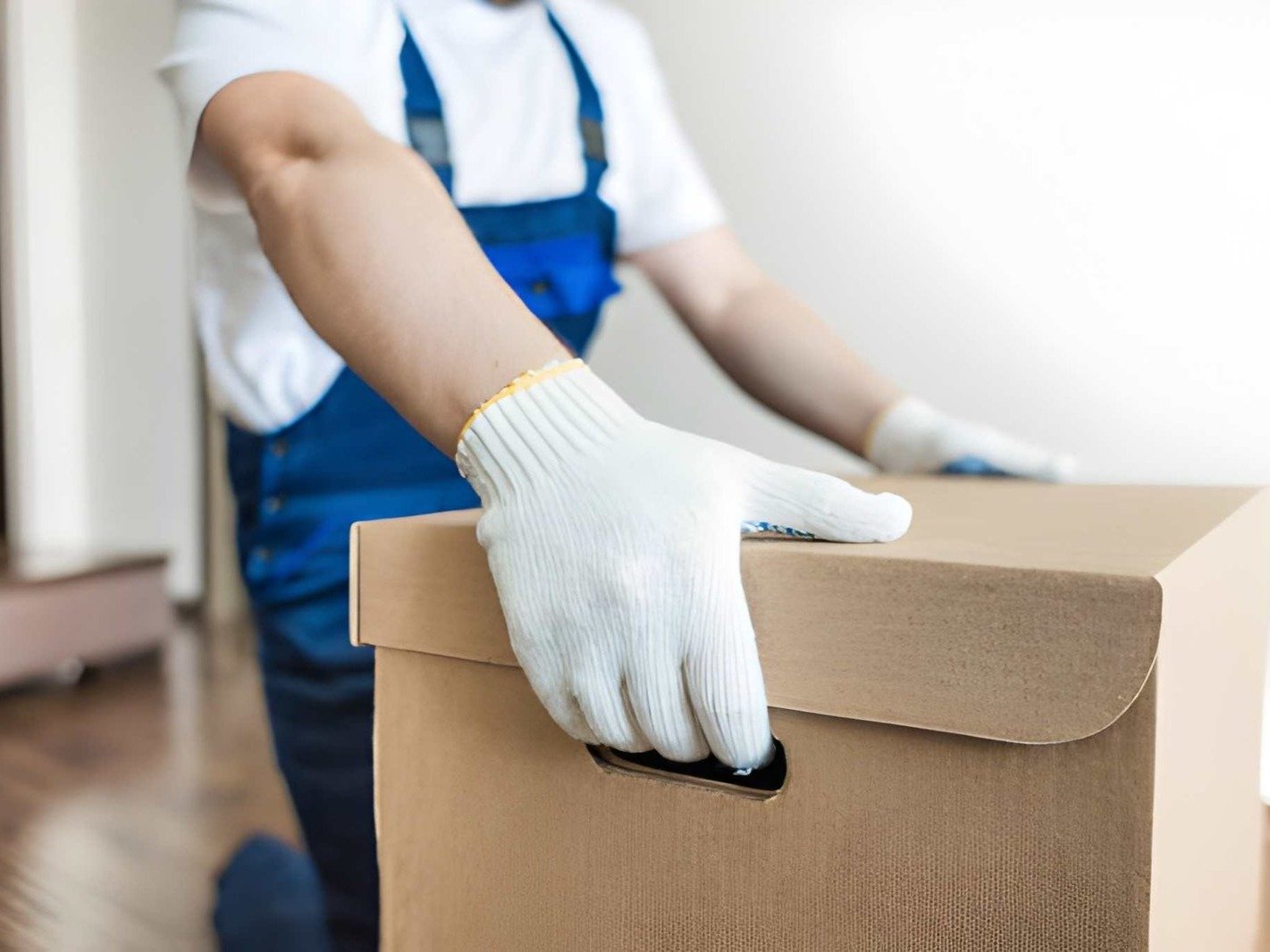 a person giving a thumbs up in front of stacked